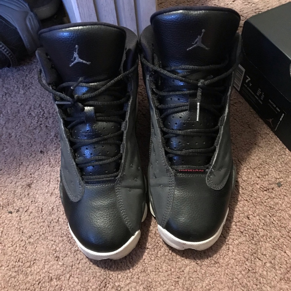 Black and white Jordan 13s